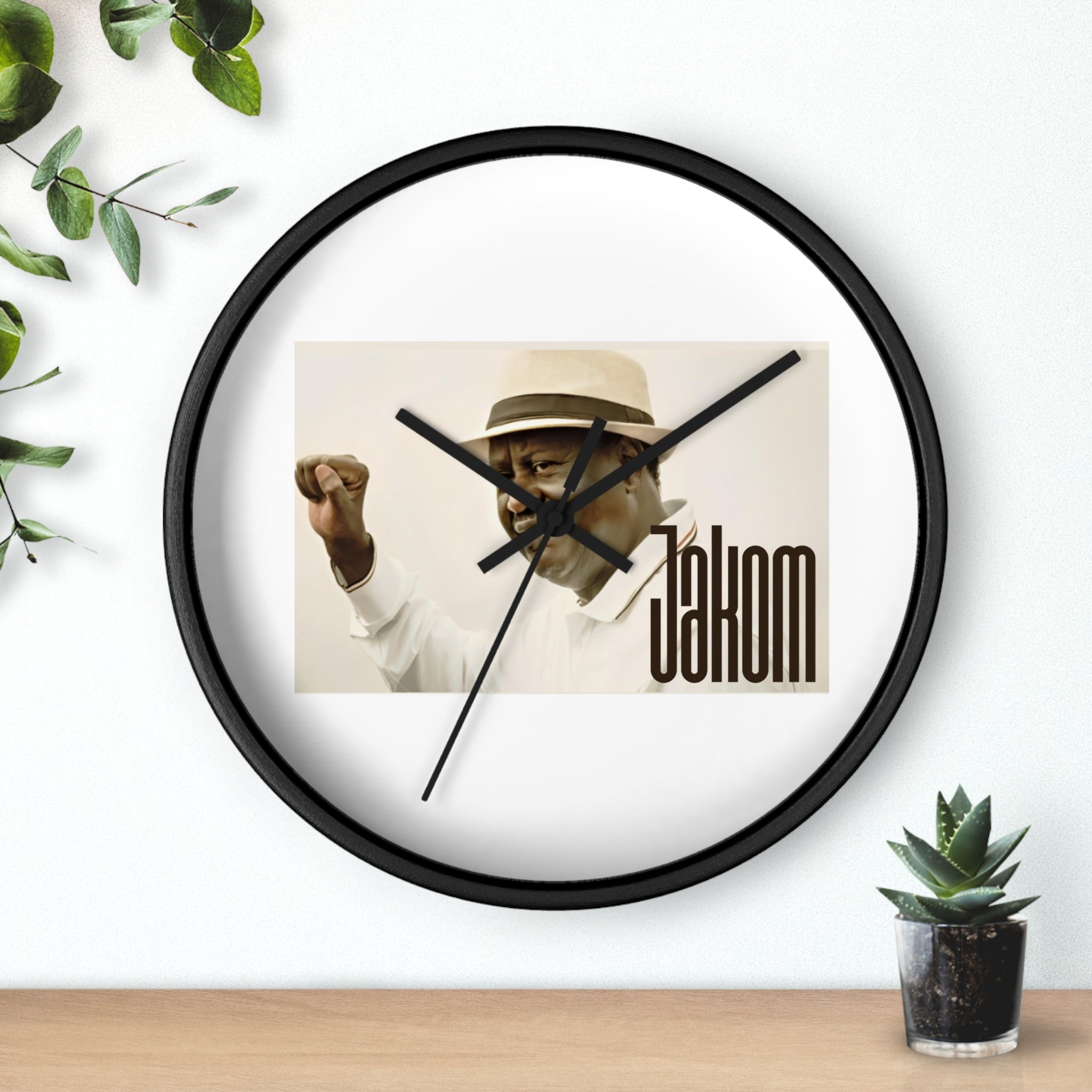 Raila Jakom 1 Wall Clock